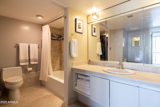 full bathroom featuring tile patterned flooring, vanity, shower / tub combo with curtain, and toilet