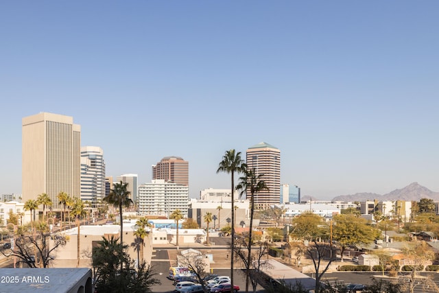 property's view of city featuring a mountain view