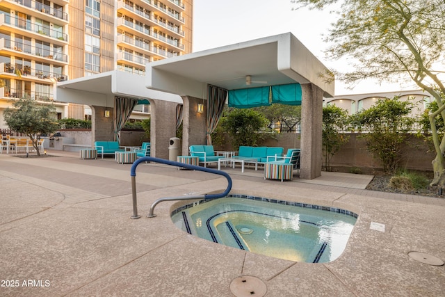 view of swimming pool featuring an outdoor living space, a patio area, and a hot tub