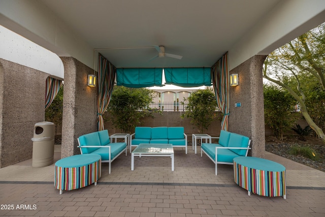 view of patio / terrace featuring ceiling fan and an outdoor living space