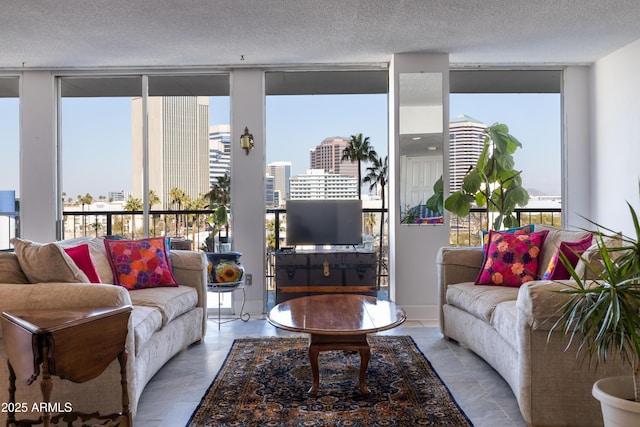 living room with expansive windows and a textured ceiling