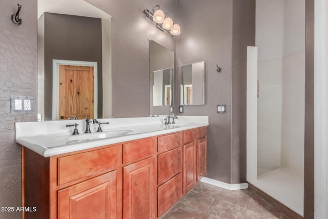 5347 E 10th Ave, Apache Junction, AZ 85119 - bathroom with double vanity, tile patterned floors, and a stall shower