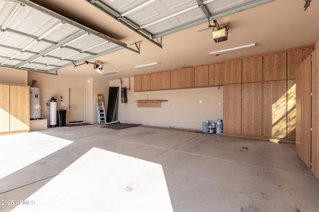 5347 E 10th Ave, Apache Junction, AZ 85119 - garage featuring electric water heater, a garage door opener, and wood walls