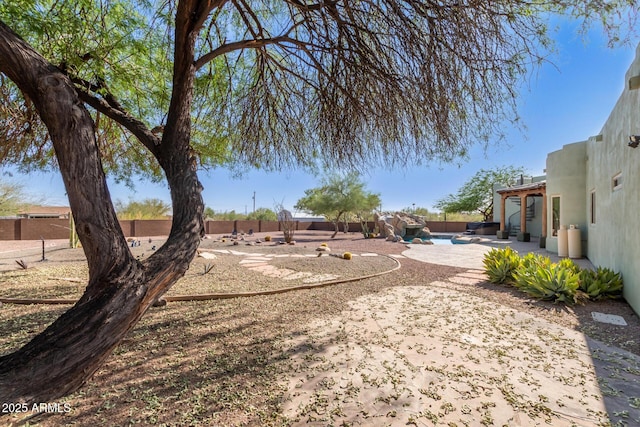 5347 E 10th Ave, Apache Junction, AZ 85119 - fenced backyard with a patio