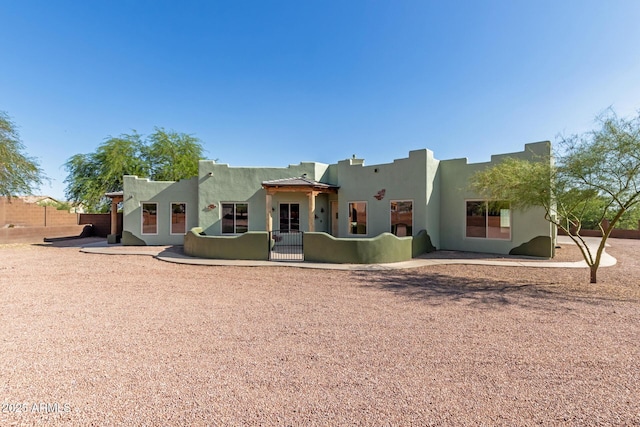 5347 E 10th Ave, Apache Junction, AZ 85119 - view of front facade featuring stucco siding and a gate