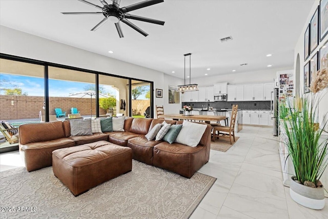 living room with ceiling fan