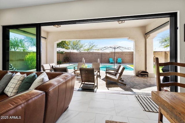 view of patio / terrace featuring an outdoor hangout area and a fenced in pool