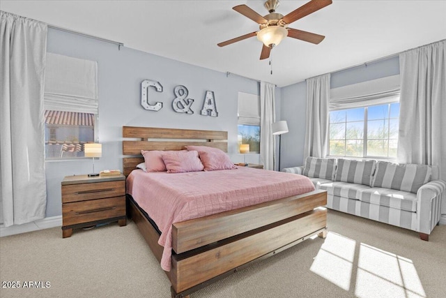 bedroom featuring ceiling fan and carpet