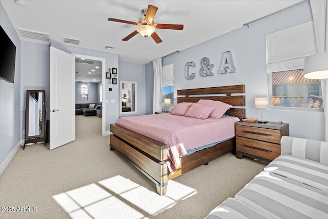 bedroom featuring ceiling fan and carpet