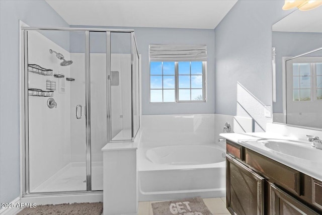 bathroom with plus walk in shower, tile patterned flooring, and vanity