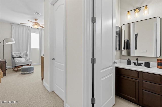 bathroom with ceiling fan and vanity