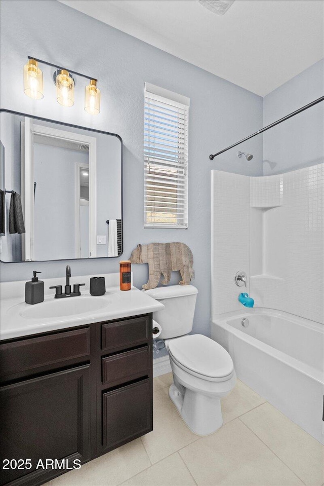 full bathroom with toilet, tile patterned flooring, bathing tub / shower combination, and vanity