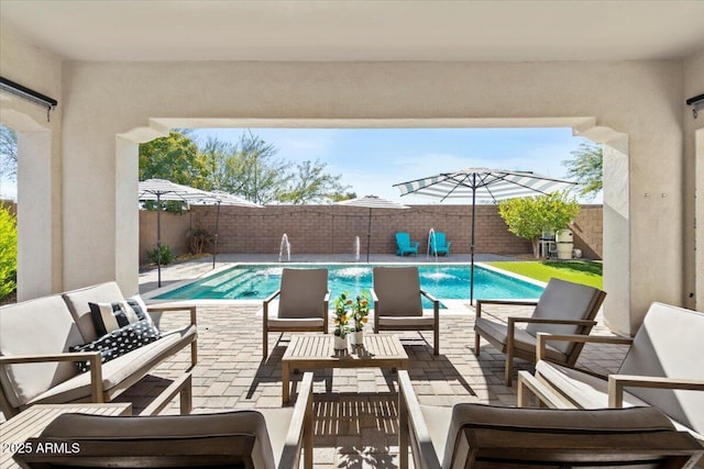 view of pool with pool water feature and a patio area