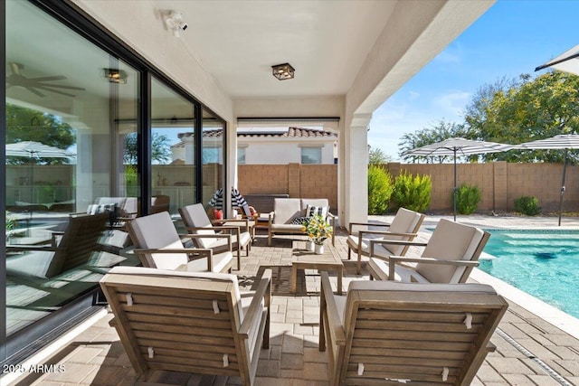 view of patio featuring a fenced in pool and outdoor lounge area