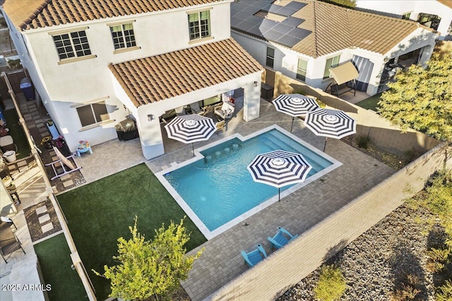 view of pool featuring a patio