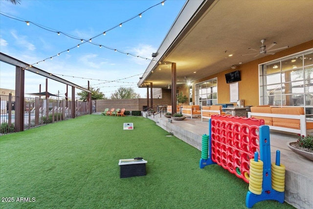 exterior space featuring ceiling fan and a patio area