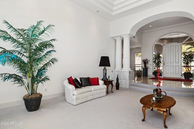 living room featuring ornate columns