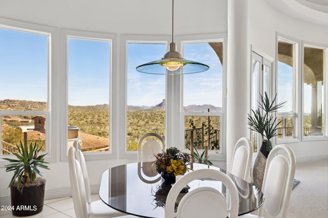 dining space featuring light tile patterned floors