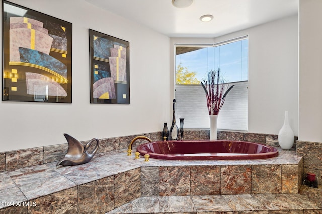 bathroom with tiled tub