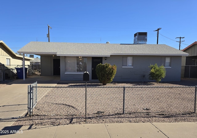 view of front facade with a carport and central AC