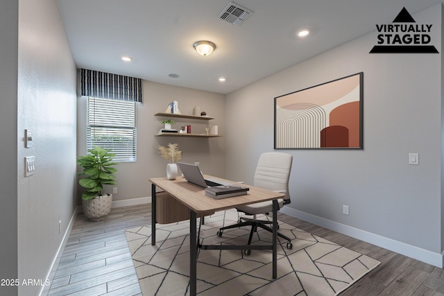 office featuring light wood-style floors, baseboards, and recessed lighting