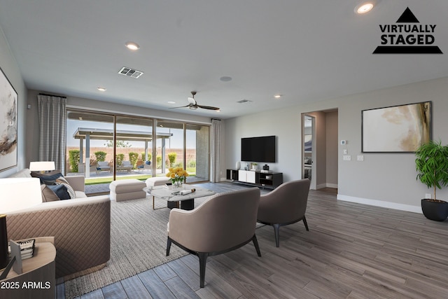 living room featuring wood finished floors, ceiling fan, baseboards, and recessed lighting