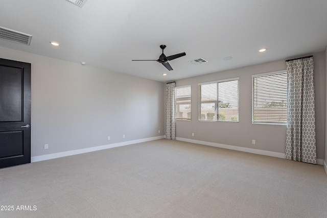 unfurnished room featuring light colored carpet, ceiling fan, recessed lighting, and baseboards