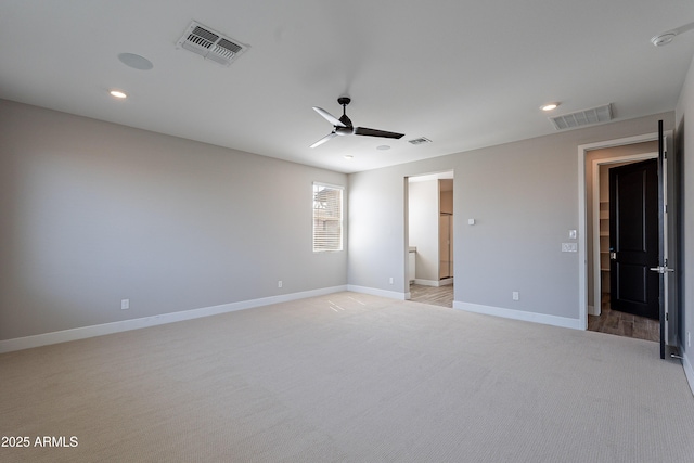 unfurnished bedroom with light carpet, baseboards, recessed lighting, and a ceiling fan
