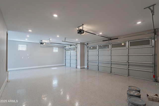 garage featuring a garage door opener, baseboards, and recessed lighting
