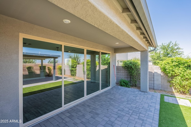 view of patio / terrace featuring fence