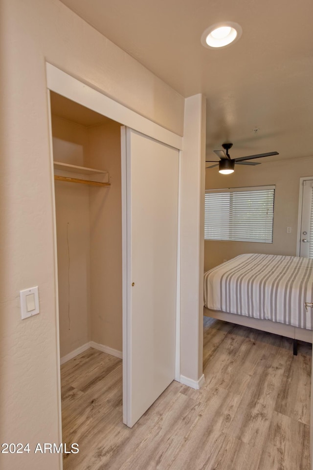 unfurnished bedroom featuring hardwood / wood-style flooring and a closet