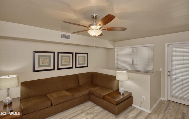 living room with ceiling fan and light hardwood / wood-style floors