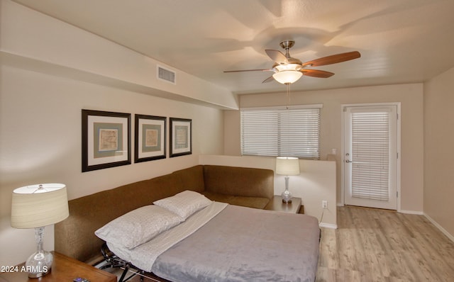 bedroom with ceiling fan and light wood-type flooring