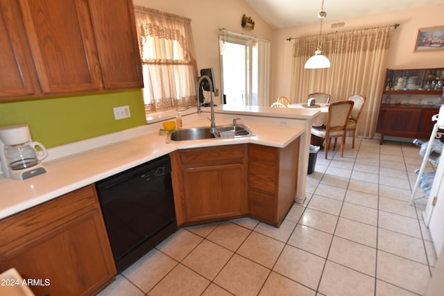 kitchen with light tile patterned floors, black dishwasher, decorative light fixtures, and sink