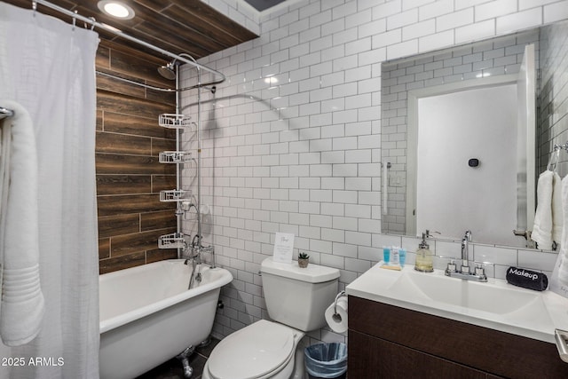 bathroom featuring toilet, shower / bathtub combination with curtain, tile walls, and vanity