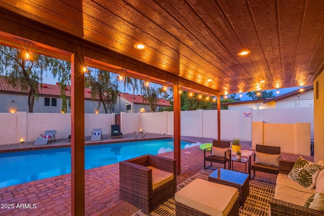 view of swimming pool with a fenced backyard, an outdoor living space, a fenced in pool, and a patio