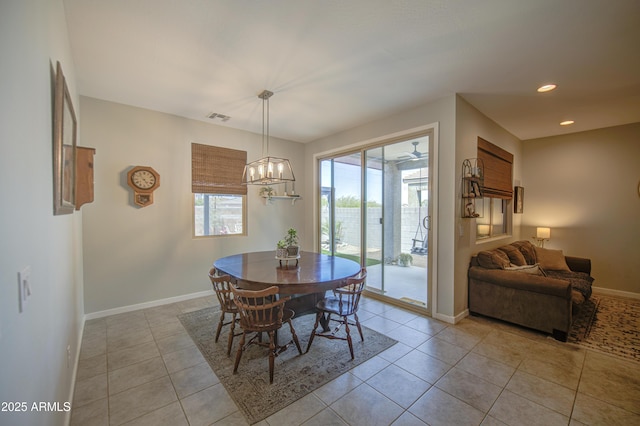 dining space featuring visible vents, baseboards, a notable chandelier, recessed lighting, and light tile patterned flooring