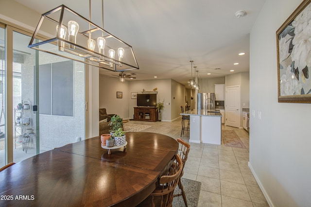 dining space with light tile patterned floors, baseboards, recessed lighting, and ceiling fan with notable chandelier