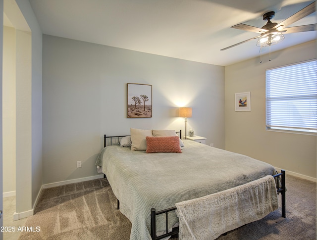 bedroom with baseboards, ceiling fan, and carpet