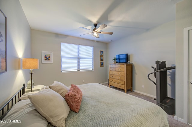 bedroom featuring baseboards, a ceiling fan, and carpet