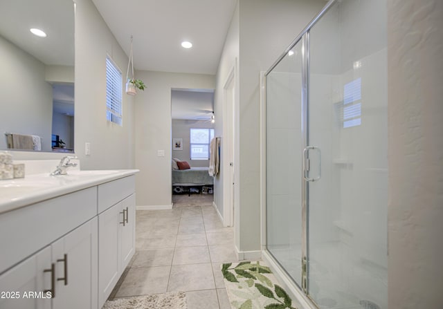 full bath featuring a sink, double vanity, ensuite bath, and a stall shower