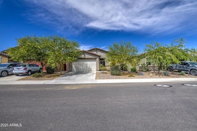 obstructed view of property with a garage, stucco siding, and driveway