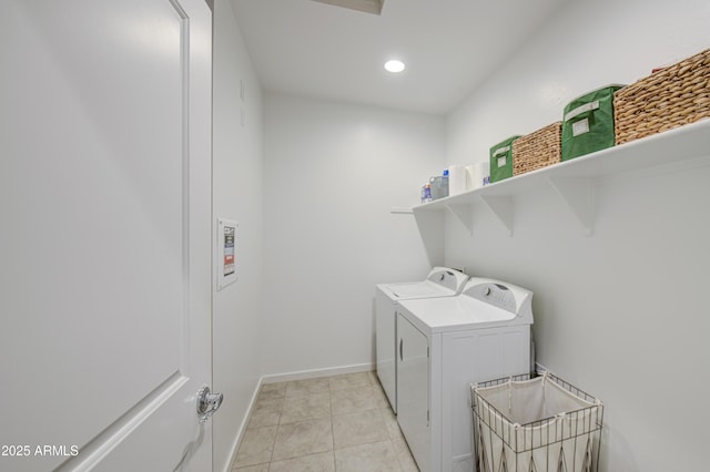 clothes washing area with laundry area, light tile patterned floors, recessed lighting, baseboards, and washer and clothes dryer