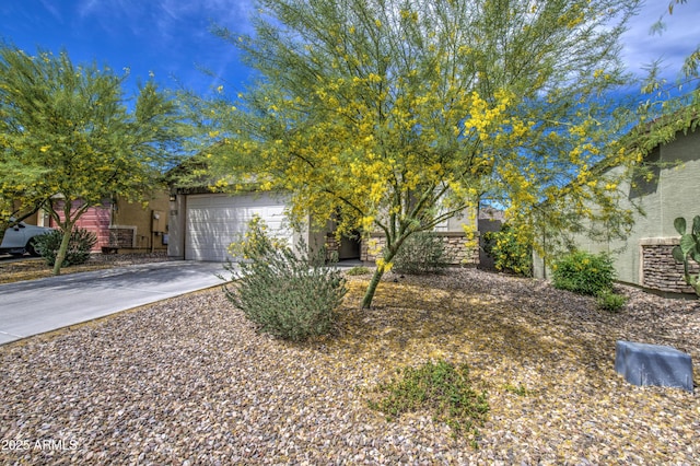 exterior space featuring driveway, stucco siding, and an attached garage