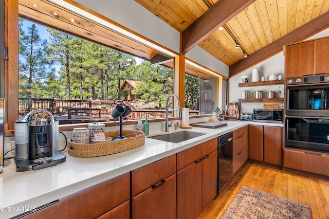 kitchen featuring wooden ceiling, sink, vaulted ceiling with beams, light hardwood / wood-style flooring, and double oven