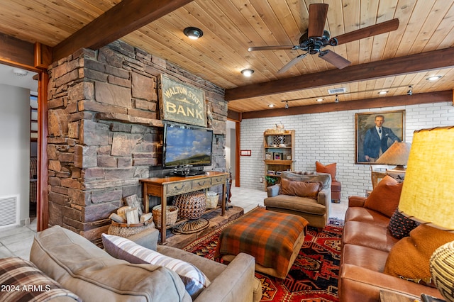 living room with brick wall, ceiling fan, beam ceiling, light tile patterned floors, and wood ceiling