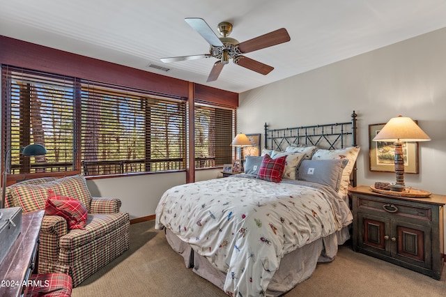 bedroom featuring light carpet and ceiling fan