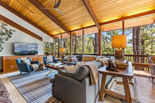 living room with wood-type flooring, wood ceiling, high vaulted ceiling, beamed ceiling, and ceiling fan