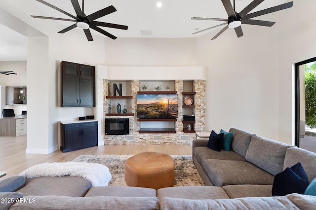 39419 N 7th Ave, Phoenix, AZ 85086 - living area with a ceiling fan, light wood finished floors, a fireplace, baseboards, and recessed lighting