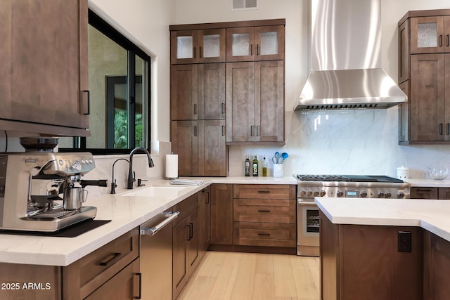 39419 N 7th Ave, Phoenix, AZ 85086 - kitchen with wall chimney exhaust hood, stainless steel appliances, a sink, and decorative backsplash